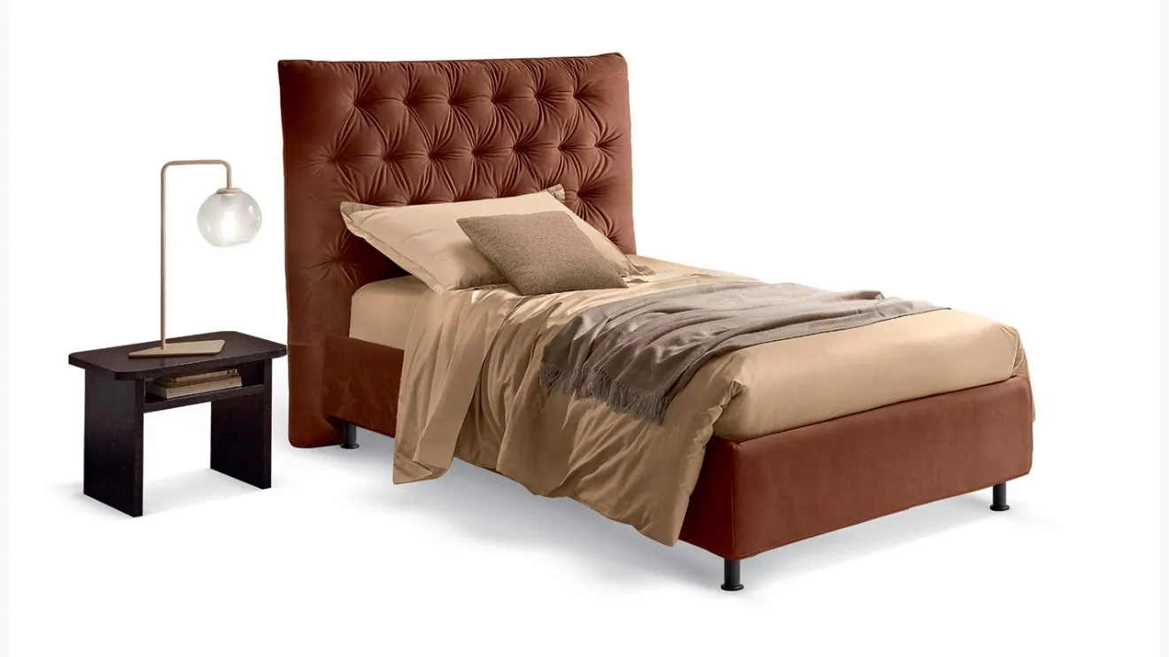 Letto singolo classico rivisitato in chiave moderna con testiera decorata con imbottitura capitonnè Artemide di Rosini Night