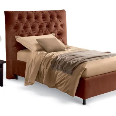 Letto singolo classico rivisitato in chiave moderna con testiera decorata con imbottitura capitonnè Artemide di Rosini Night